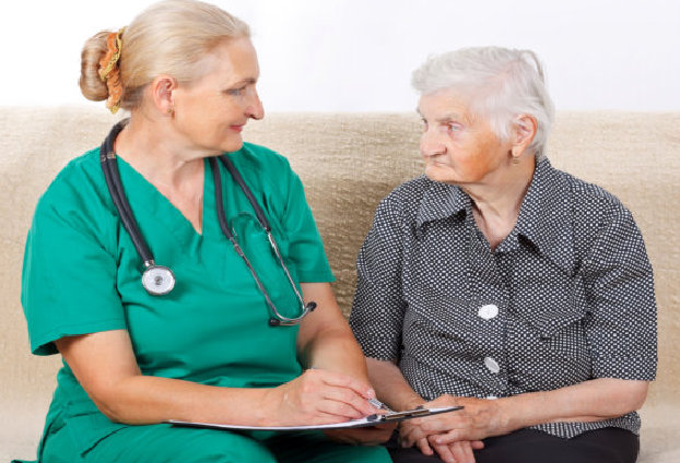 caregiver and elderly woman talking